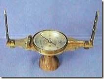 A pictures of a compass used for land surveying.