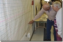 Guests looking for names on a map